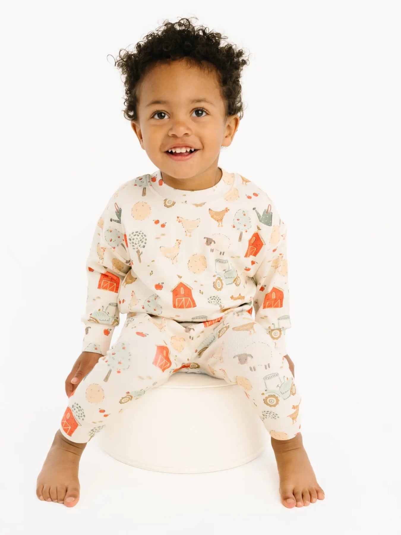 Toddler wearing the crew neck lounge set with farm day details.