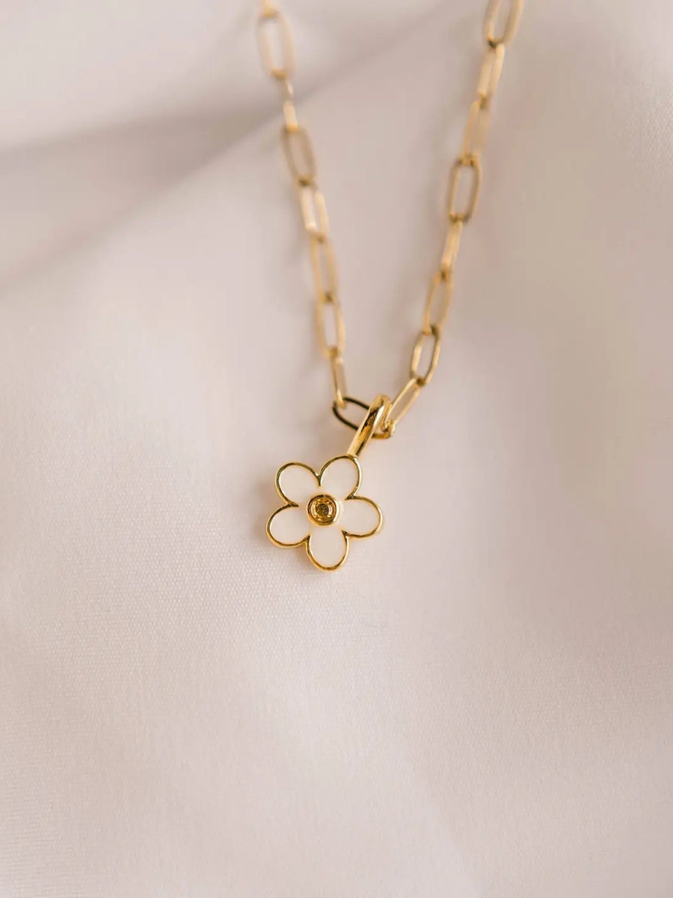 A thoughtful and encouraging necklace as a daily reminder for yourself or as a gift for someone in your life. This necklace is 14kt gold plated necklace with simple flower design and comes with a verse reference card.
