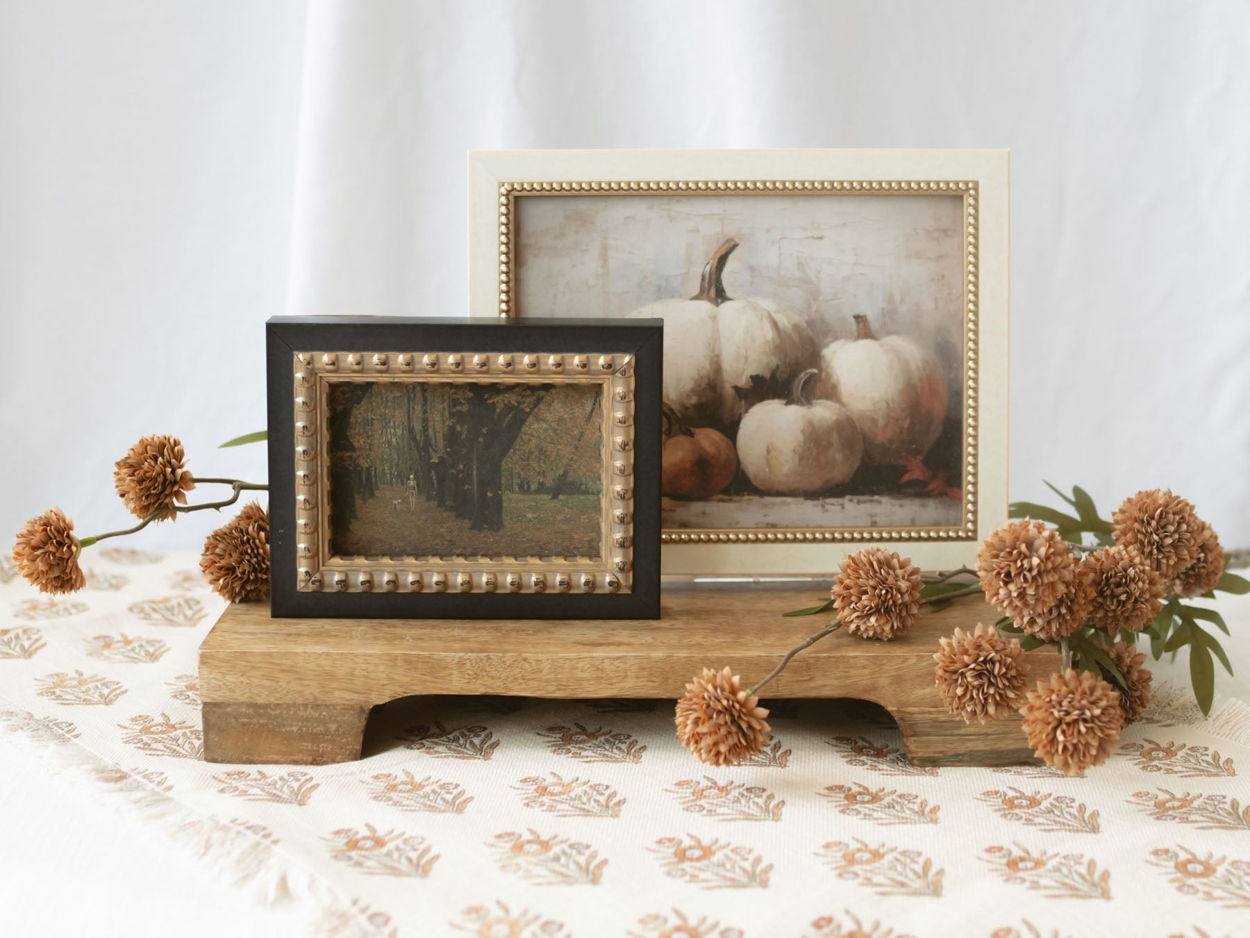 A warm seasonal artwork featuring a collection of heirloom pumpkins arranged in a classic still-life composition. Soft neutral tones, rich texture, and painterly brushwork create a timeless harvest-inspired accent perfect for fall decorating.