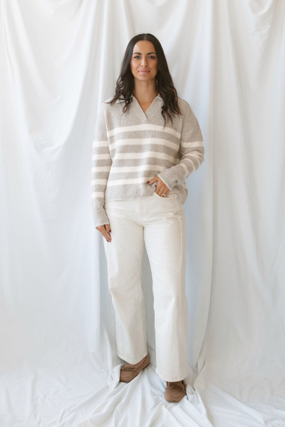 Carly light taupe striped knit sweater with a collared V-neckline and contrast trim.