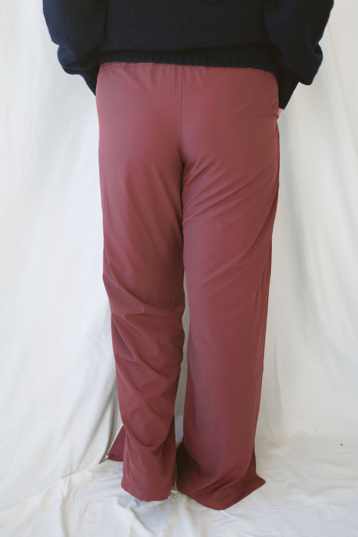 Jordan Finish Line women's track pants in Rosewood, featuring a muted earthy pink color and sporty casual silhouette for relaxed everyday outfits.