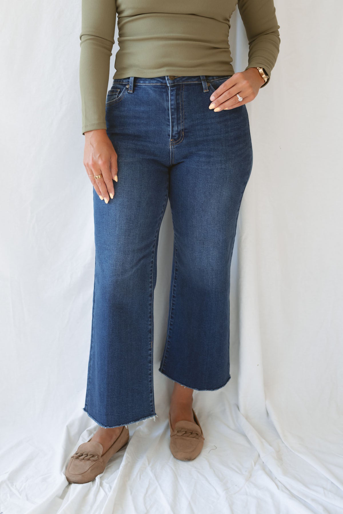Model wearing the scissor cut slim denim in a dark wash. Great length to wear with a pointed toe boot or sneaker. Can easily be dressed up or down.