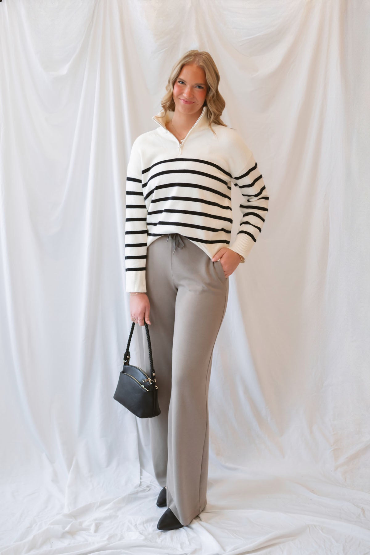 Maggie Striped Half Zip Mock Neck Knit Sweater Top in Cream and Black featuring a striped pattern and half-zip neckline.