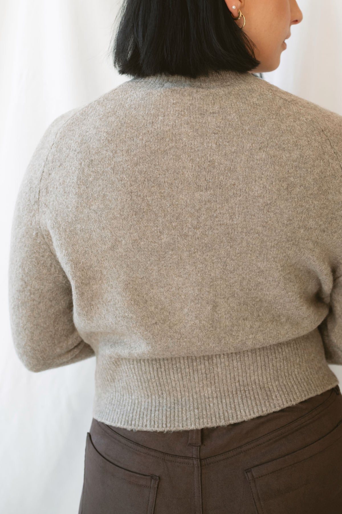Donna women's Taupe sweater cardigan featuring a classic round neckline, long sleeves, and neutral knit texture for casual everyday layering.