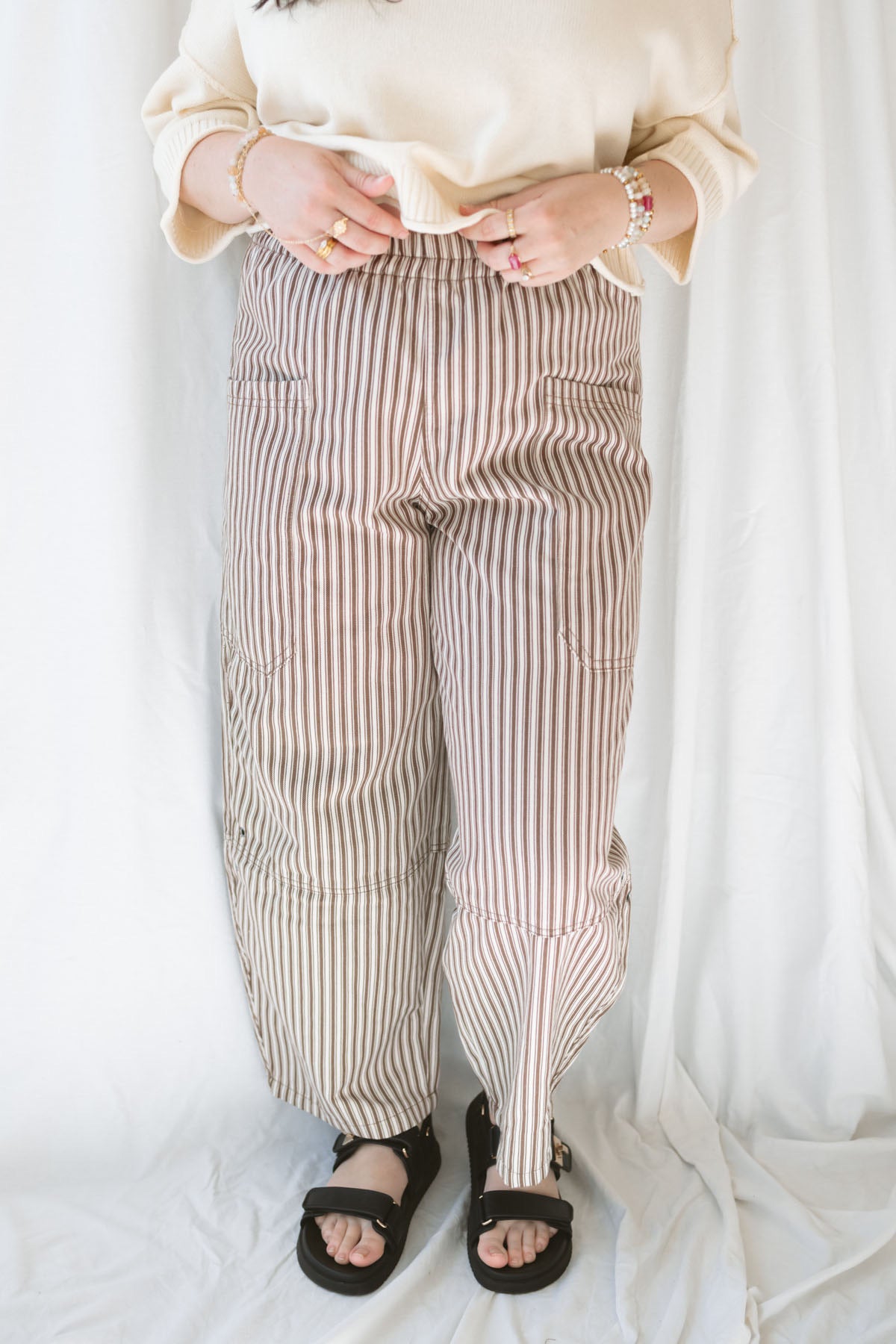Model wearing the stripe pocket detail wide leg pants.