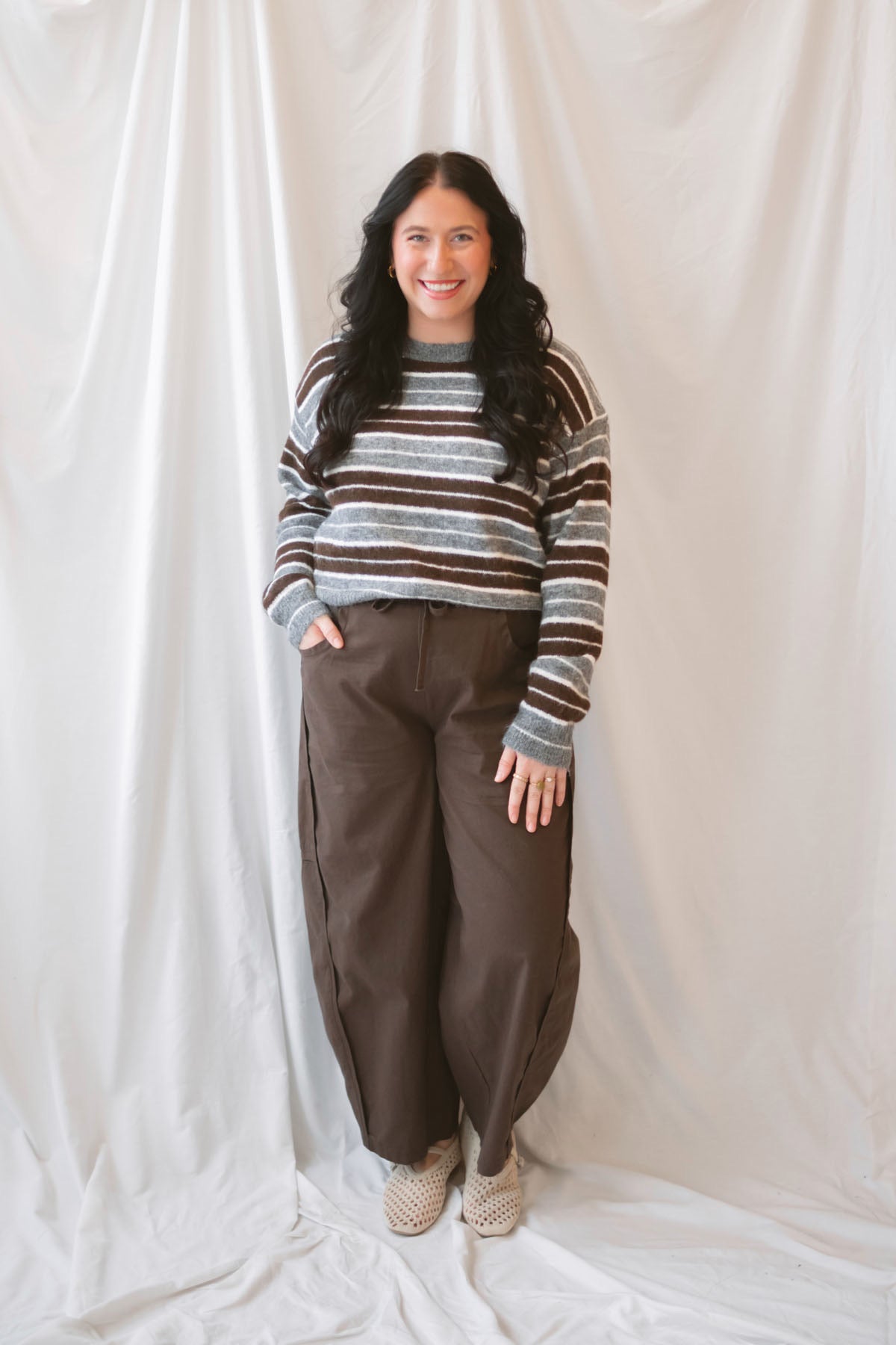 Abbie Striped Crew Neckline Long Sleeve Cropped Knit Sweater in Brown Multi with a warm neutral stripe pattern.