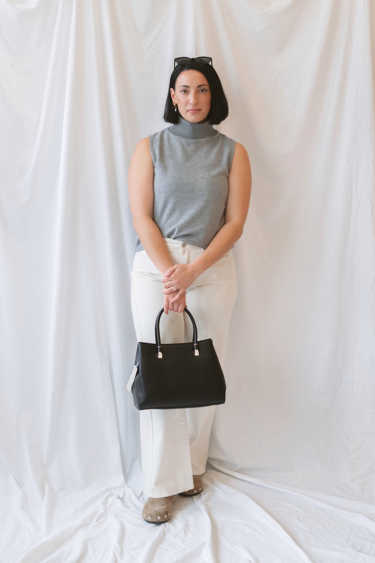 Kori Sleeveless Turtle Neck Soft Knit Top in Grey featuring a sleeveless silhouette and classic turtle neckline.