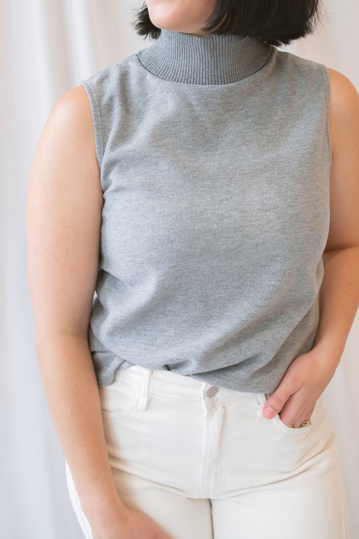 Kori Sleeveless Turtle Neck Soft Knit Top in Grey featuring a sleeveless silhouette and classic turtle neckline.