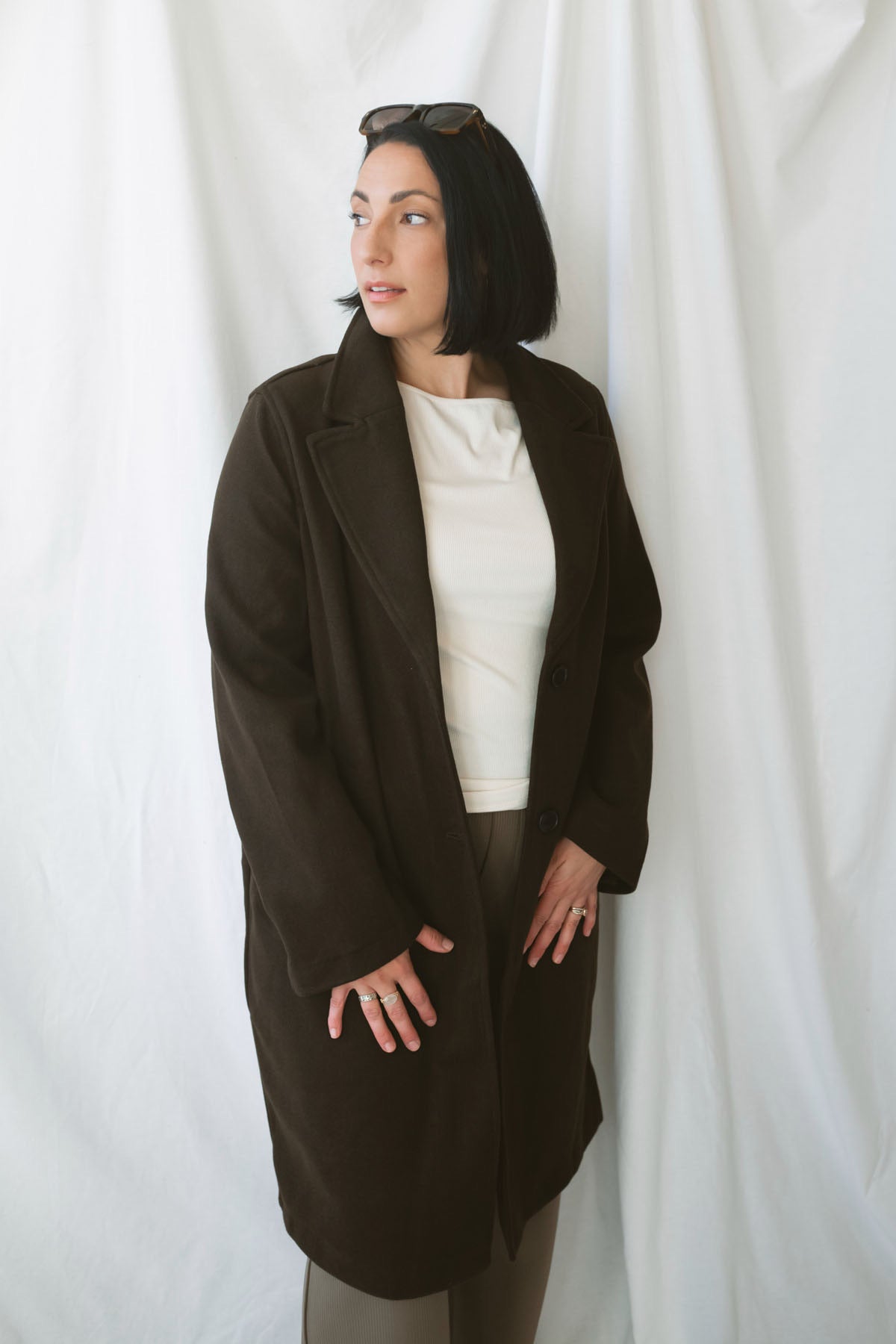Carrie women's soft long coat in Brown featuring a classic extended-length silhouette and long sleeves for stylish fall and winter layering.