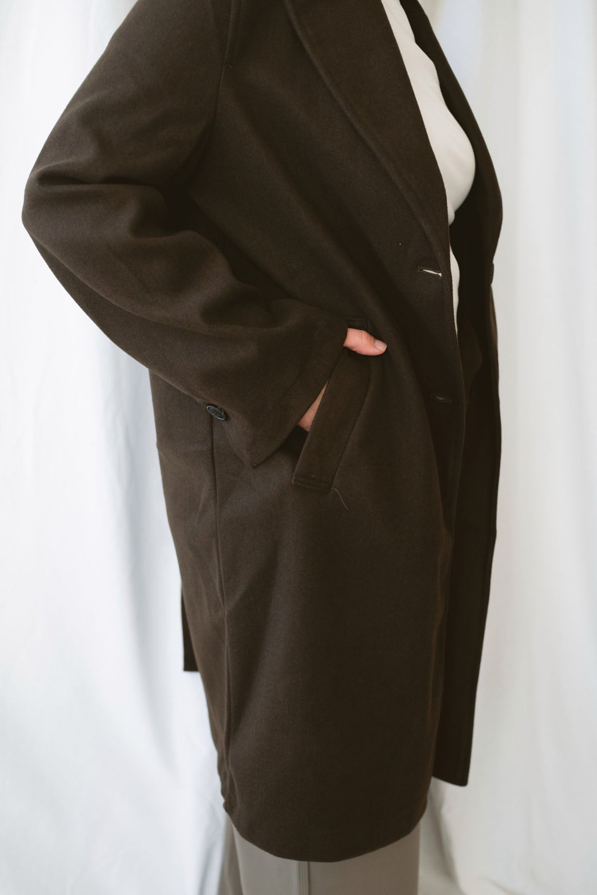 Carrie women's soft long coat in Brown featuring a classic extended-length silhouette and long sleeves for stylish fall and winter layering.