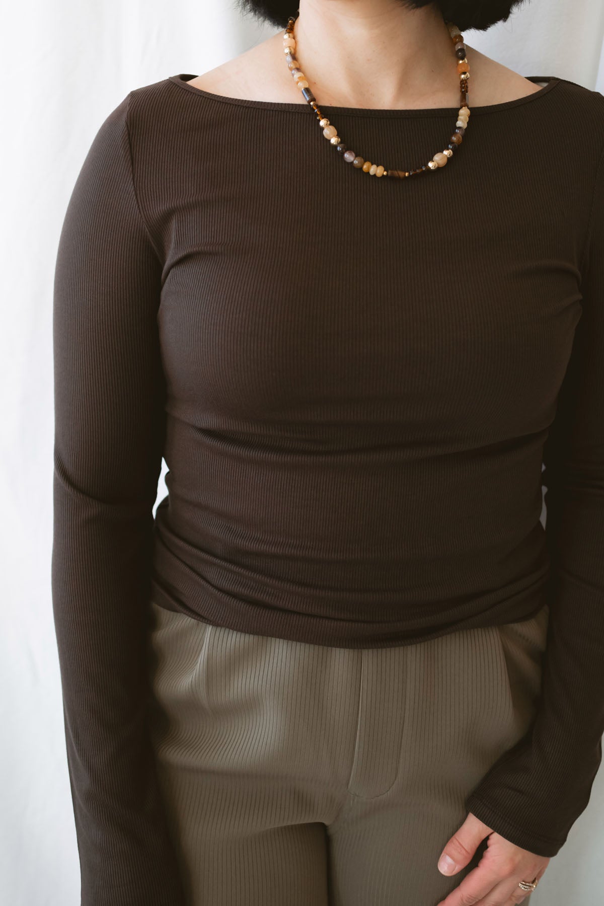 Brynley Boat Neck Micro Ribbed Top in Coffee Bean brown, featuring a feminine boat neckline, subtle ribbed texture, and long sleeves for women's everyday outfits.