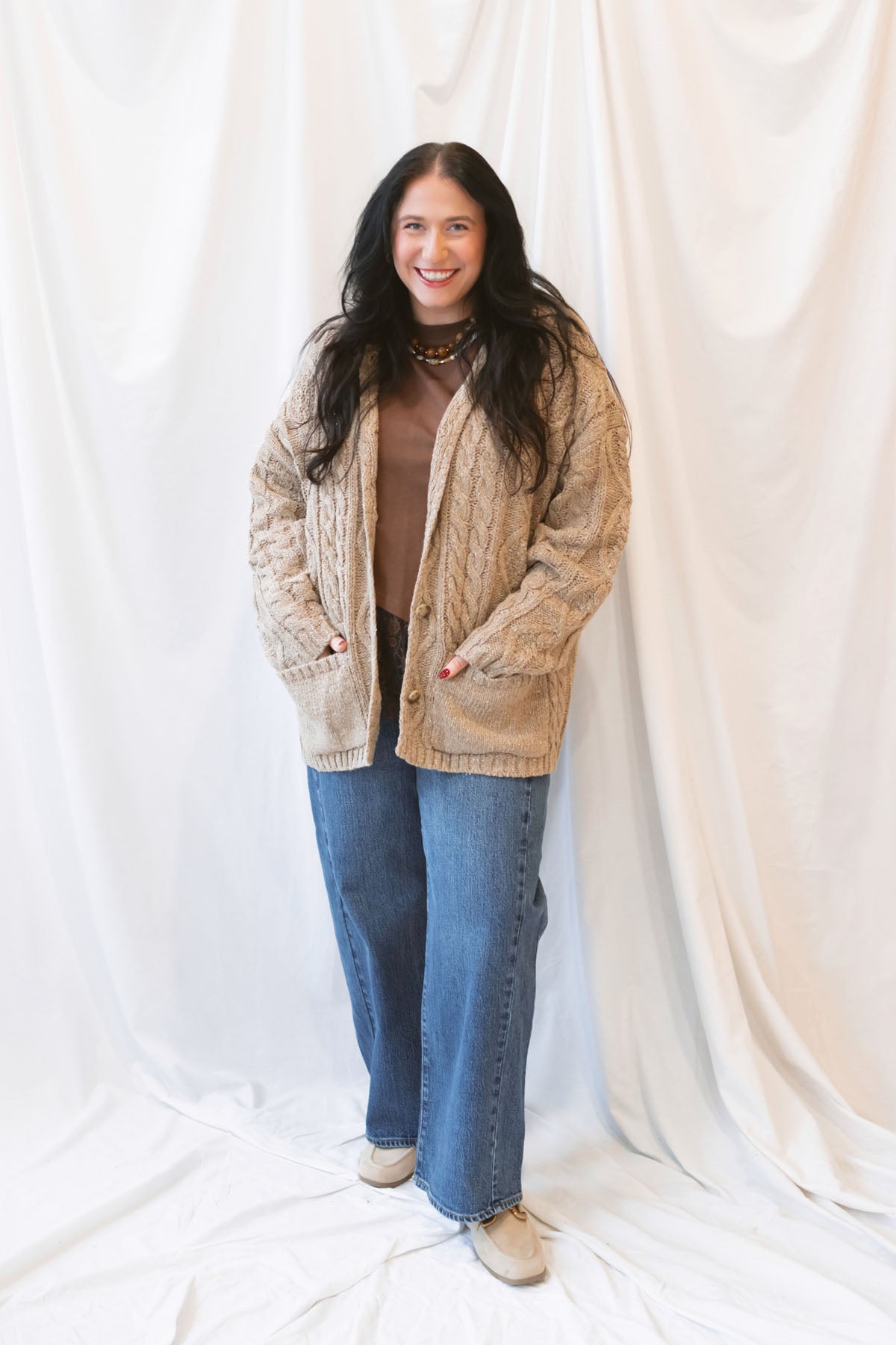 Beige oversized cable knit cardigan for women featuring a collared neckline, textured knit design, and relaxed fit.