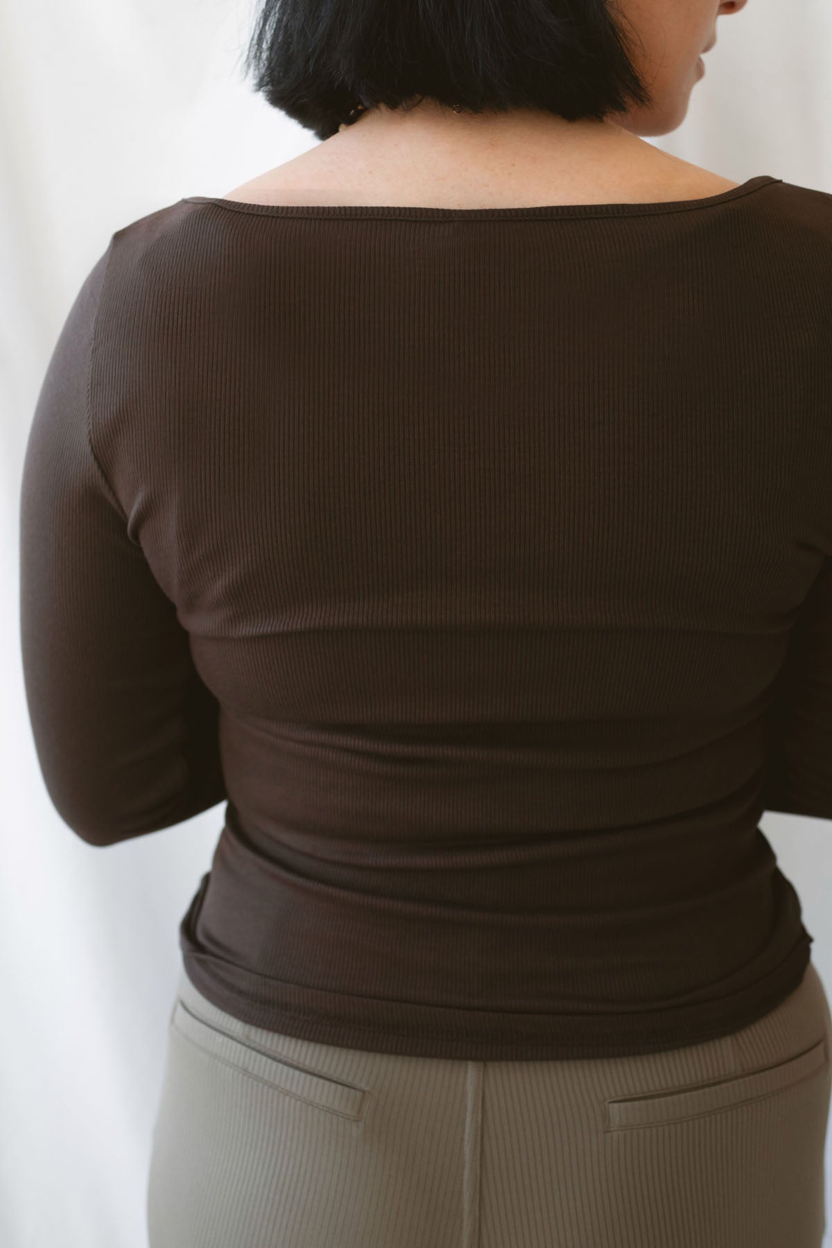 Brynley Boat Neck Micro Ribbed Top in Coffee Bean brown, featuring a feminine boat neckline, subtle ribbed texture, and long sleeves for women's everyday outfits.