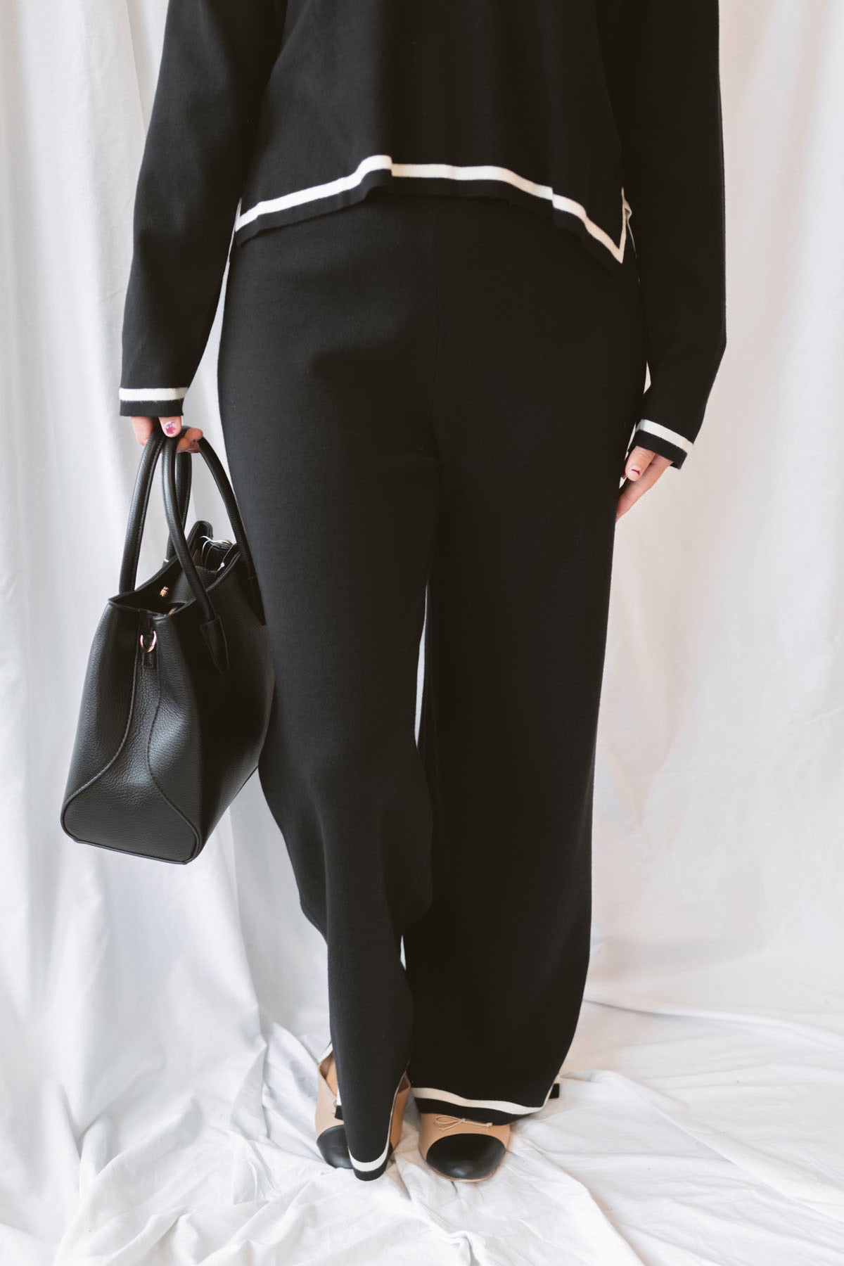 Laura Black Contrast Stripe Trim Collar Knit Sweater and Pants Set featuring a collared sweater and coordinating knit pants with contrasting stripe details.