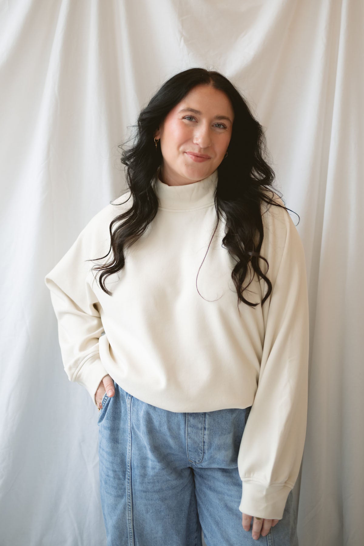 Model wearing the double brushed mock neck pullover.