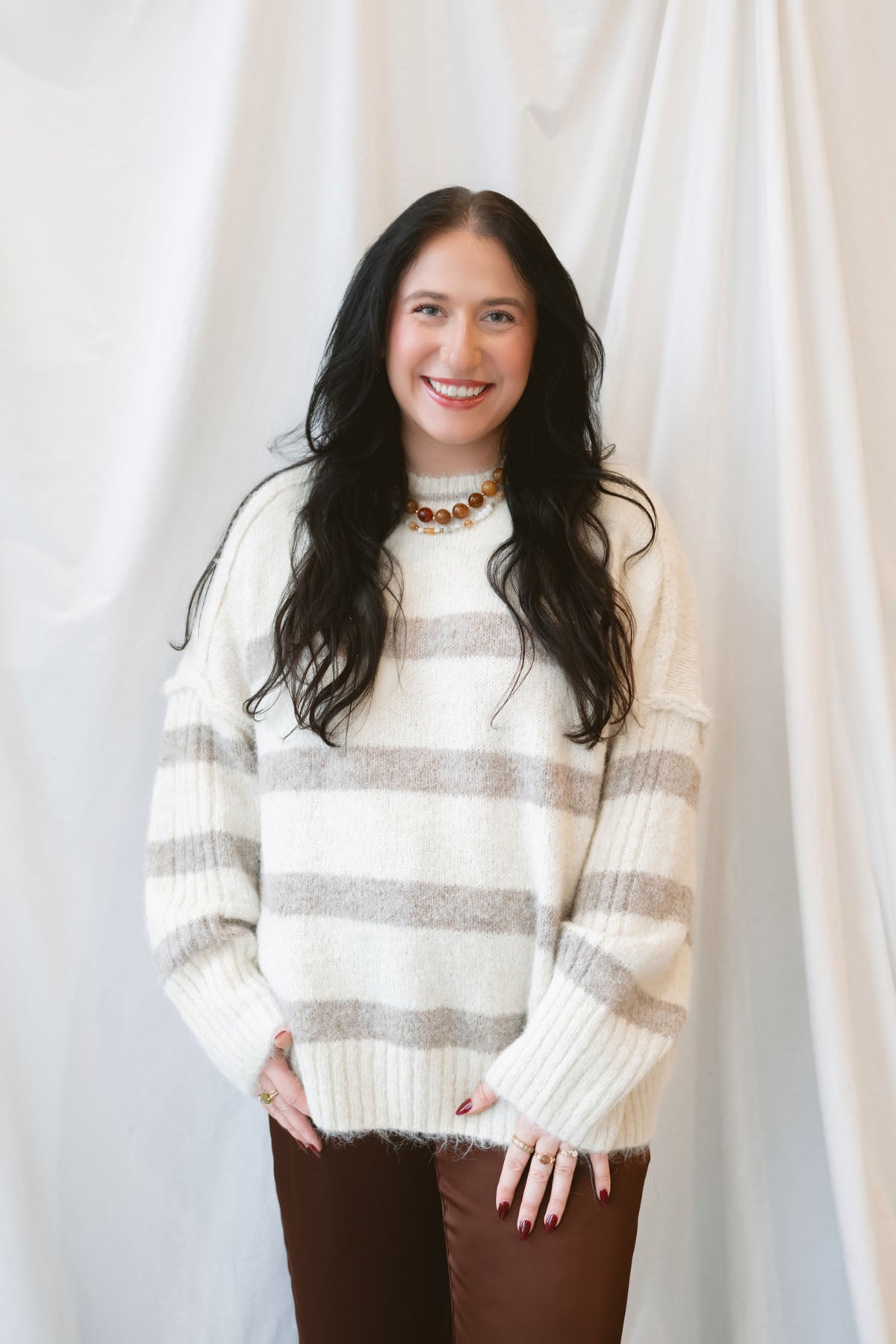 Cream fuzzy knit sweater for women featuring a classic striped pattern, relaxed boyfriend fit, and cozy textured finish for casual fall and winter styling.