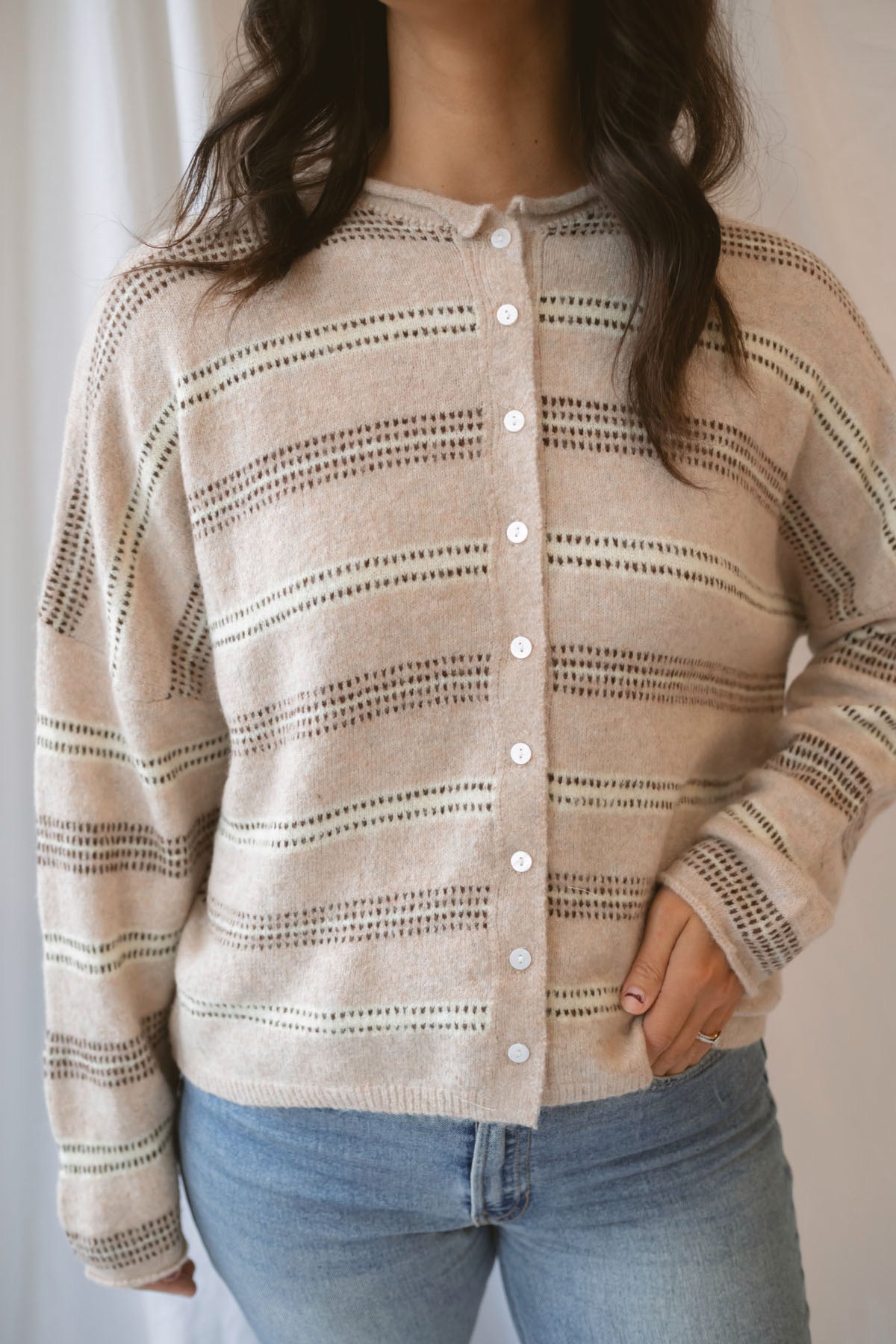 Krista Striped Sweater Cardigan in Beige Multi with classic neutral stripes and rolled-edge details.