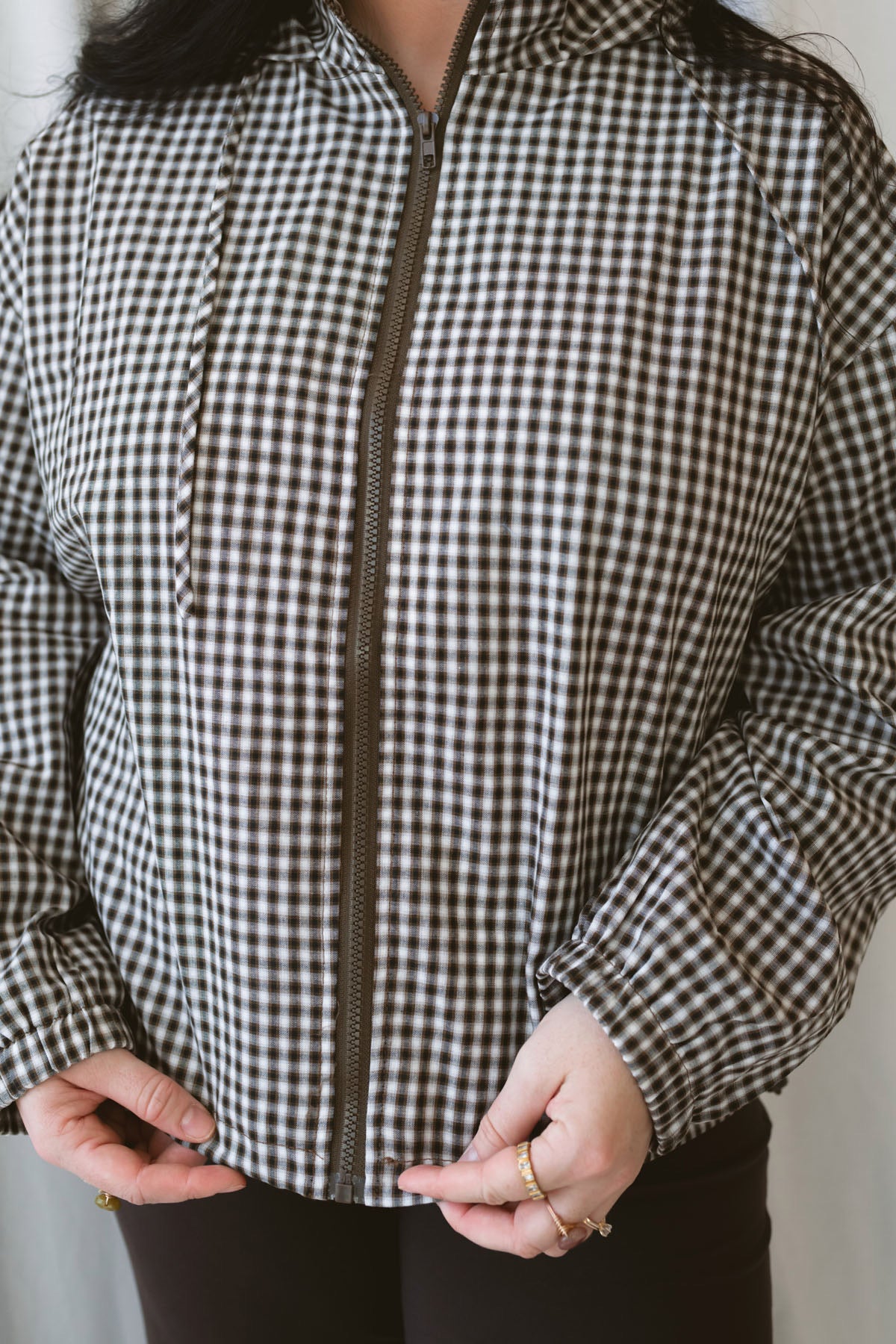 Lainey brown multi checkered hooded zip-up jacket with a relaxed everyday fit.