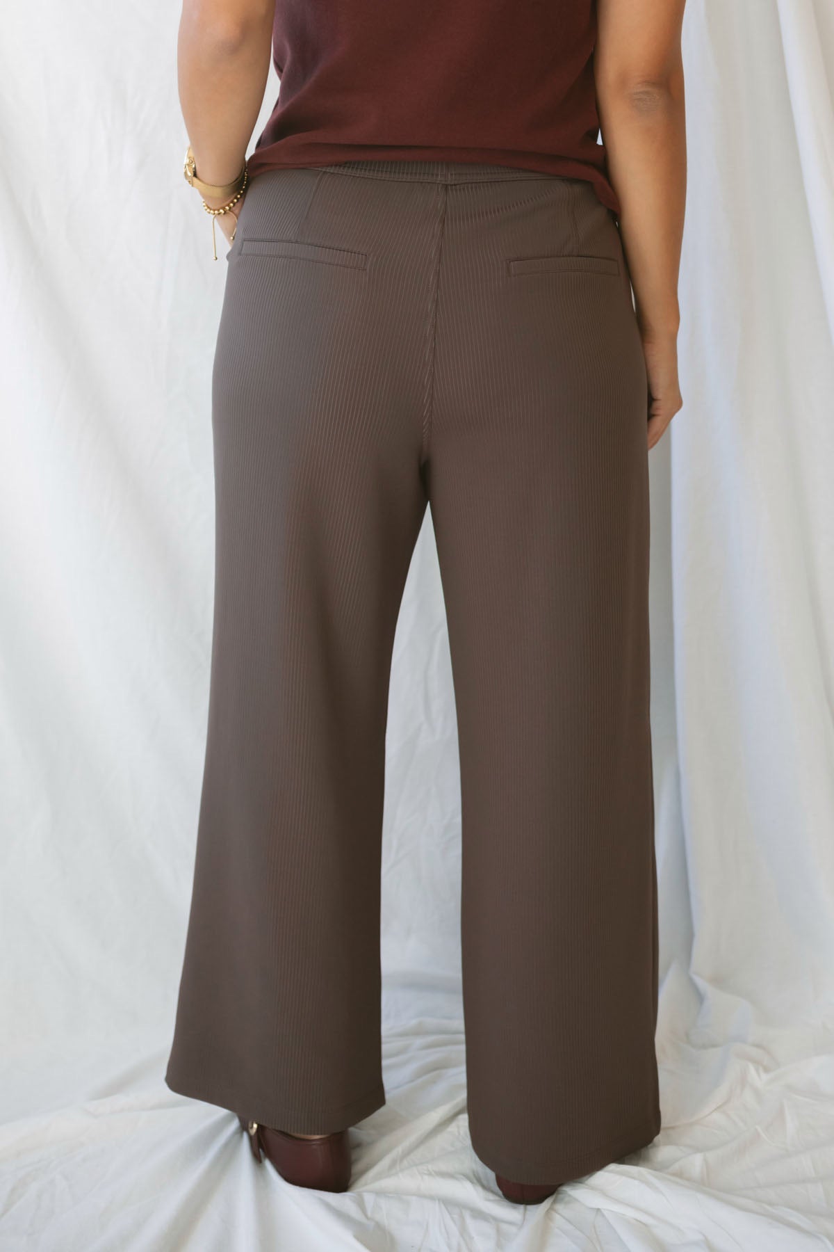 Model wearing the ribbed tailored trousers.