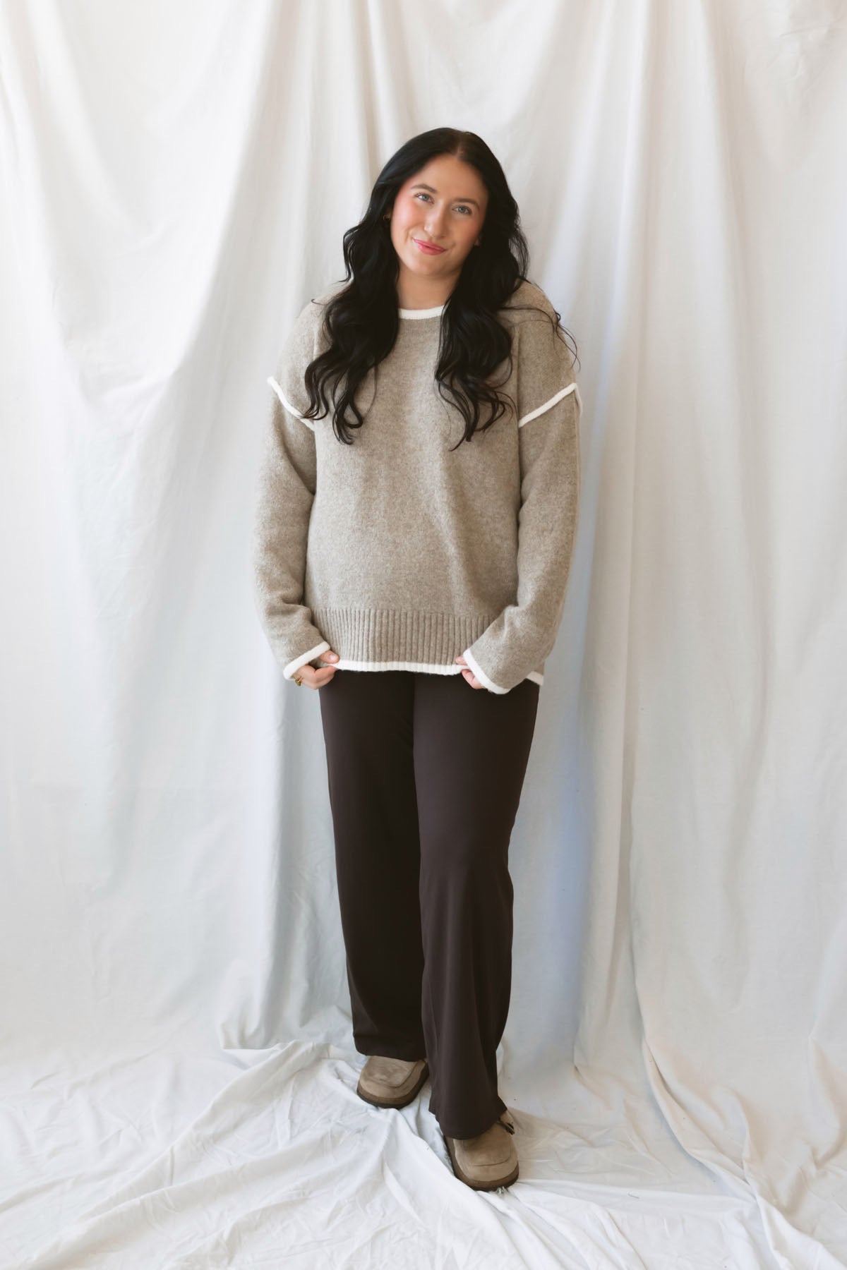Juliana light mocha knit sweater top with long sleeves, contrast trim, and side slit hem.