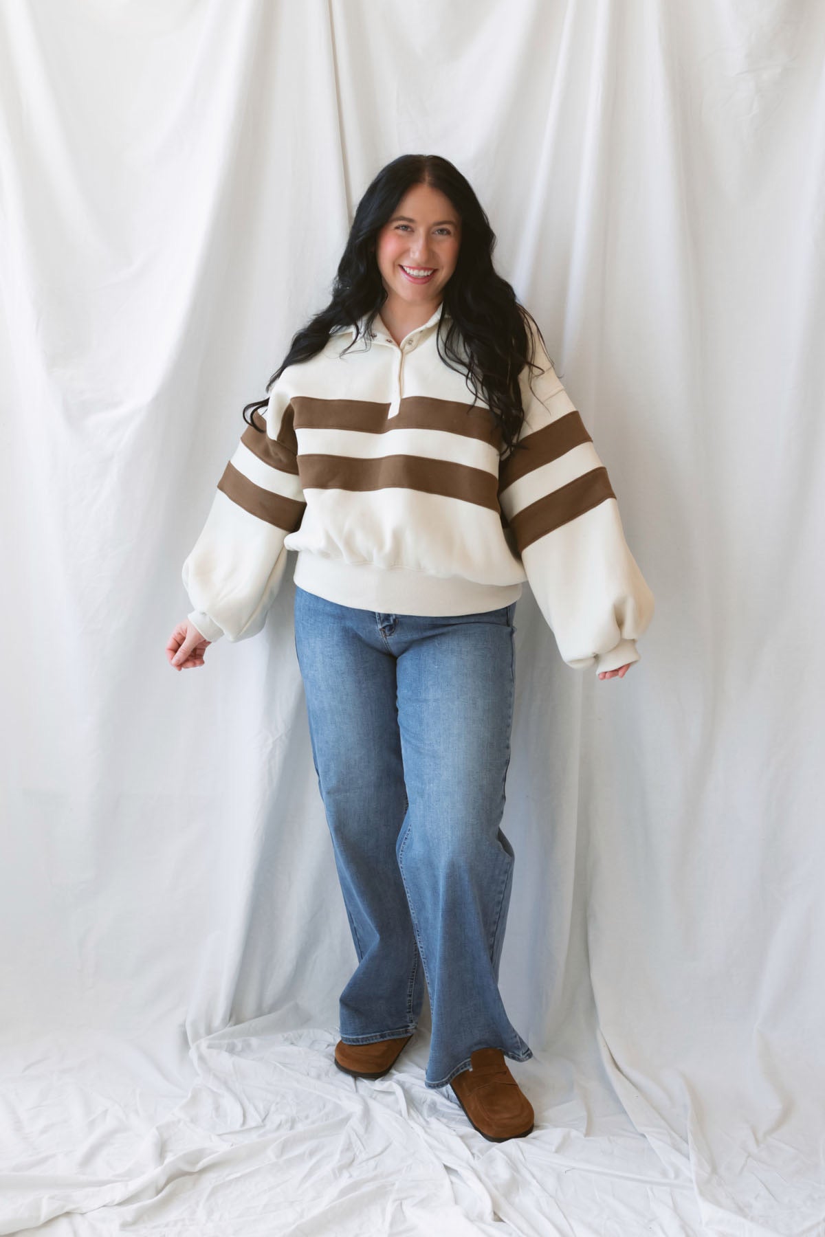 Lottie rugby-inspired pullover featuring horizontal cream and camel stripes.
