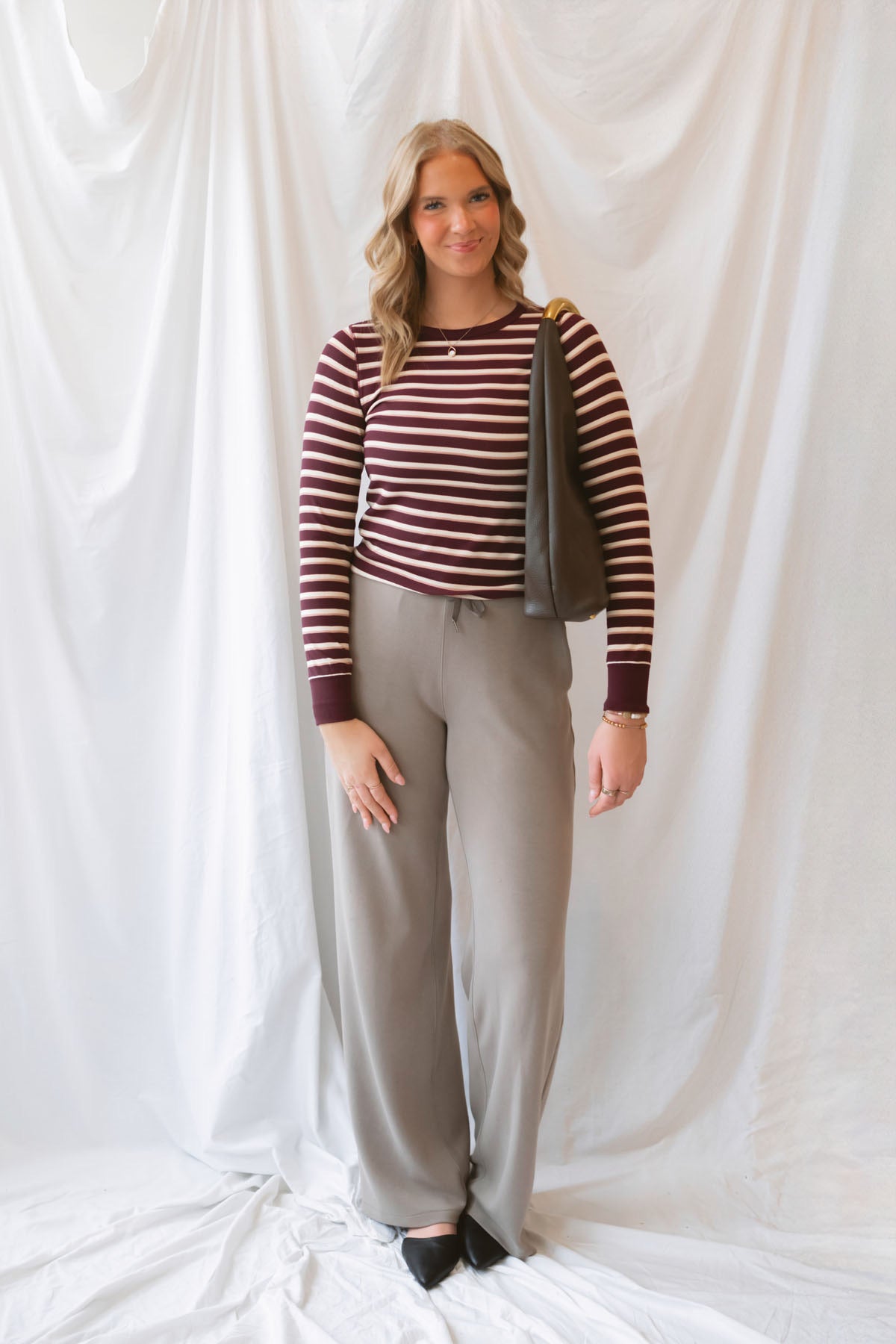 Stacy women's striped top in a rich maroon colorway, featuring a classic stripe pattern for everyday styling.
