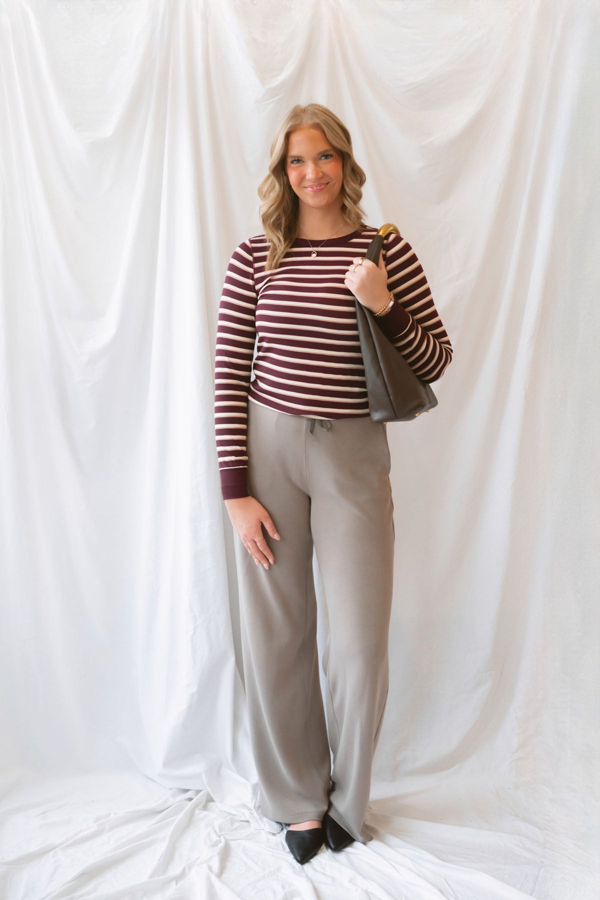 Stacy women's striped top in a rich maroon colorway, featuring a classic stripe pattern for everyday styling.
