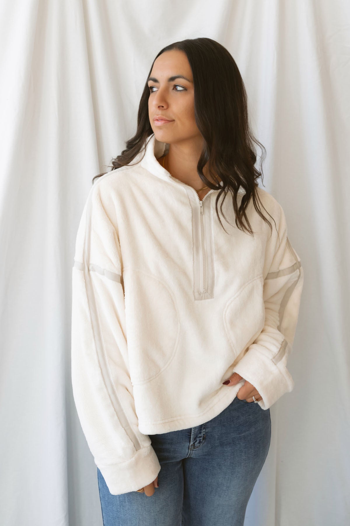 Fiona ivory half zip fleece pullover with contrasting trim details and long sleeves.
