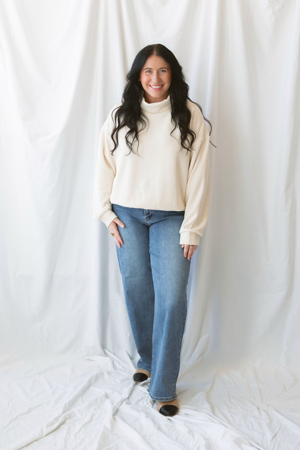 Maisie alpaca waffle sweatshirt with a cozy funnel neckline and long sleeves.
