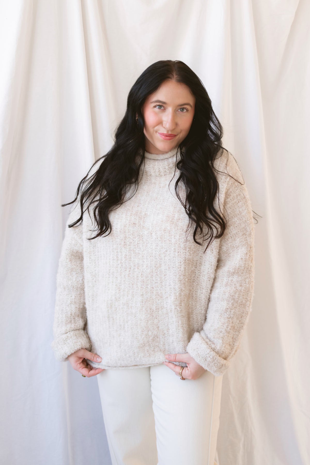 Emily oatmeal fuzzy knit sweater with a raw-edge mock neckline and long sleeves.