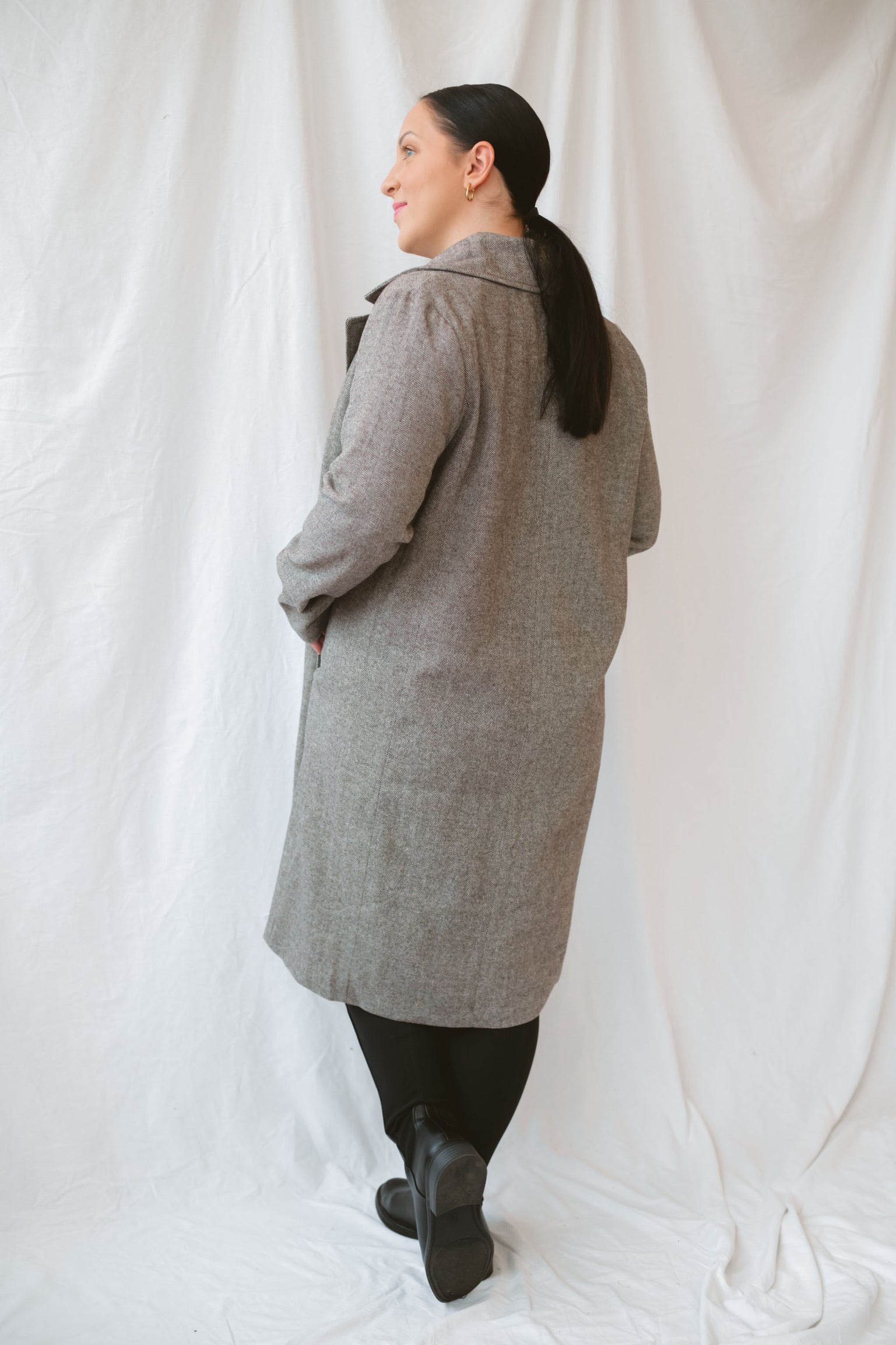 Model wearing the millie coat over an all black base. Lightweight and versatile.