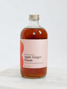 Apple Ginger Smash on a marble tray with a white background 