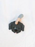 black lab teether for babies on a white background