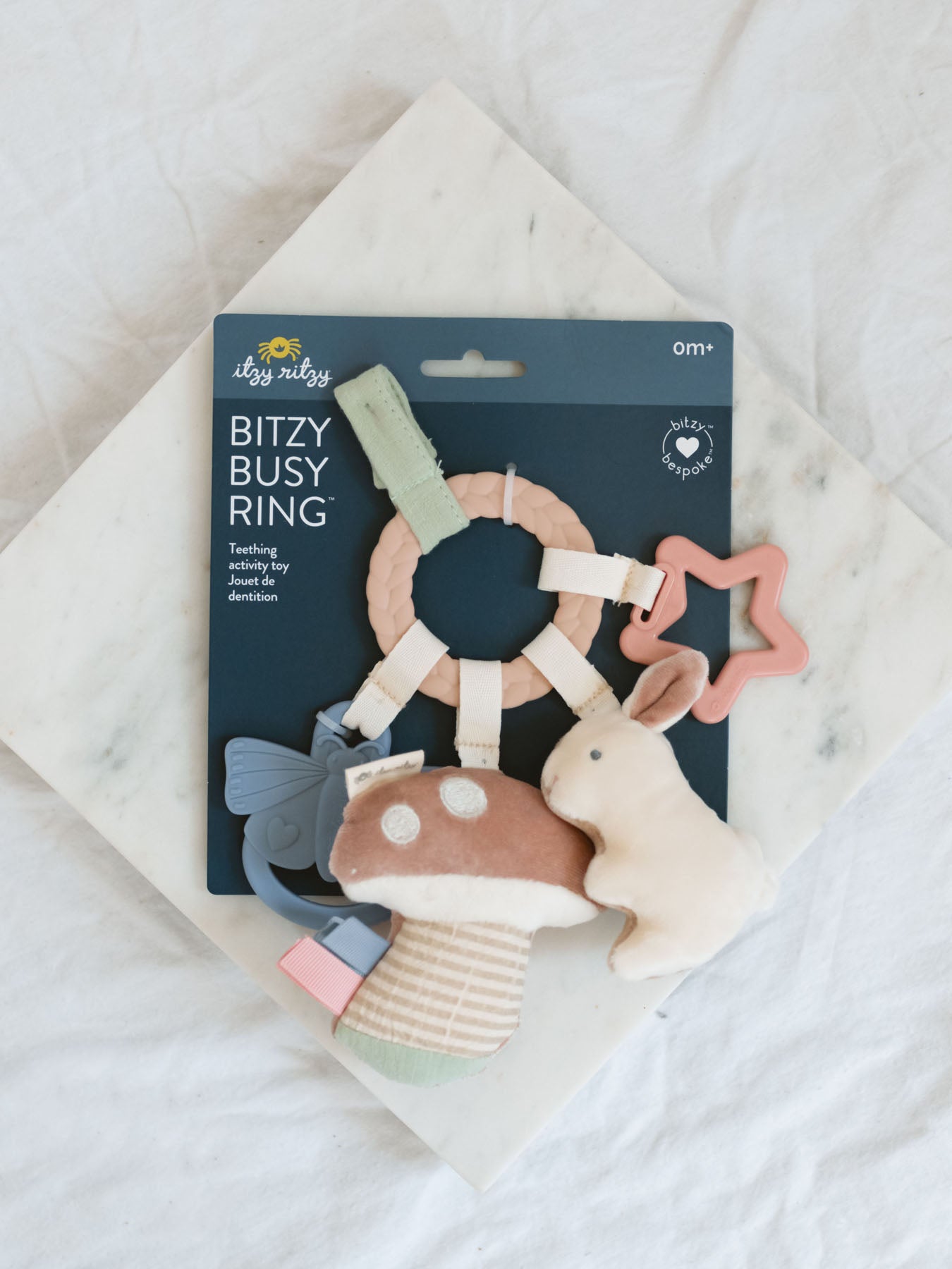 Teething ring toy with mushroom, bunny, silicone star and silicone butterfly. 