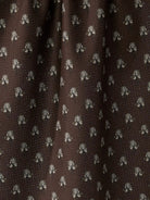 Brown Tea Towel owes light flower details 