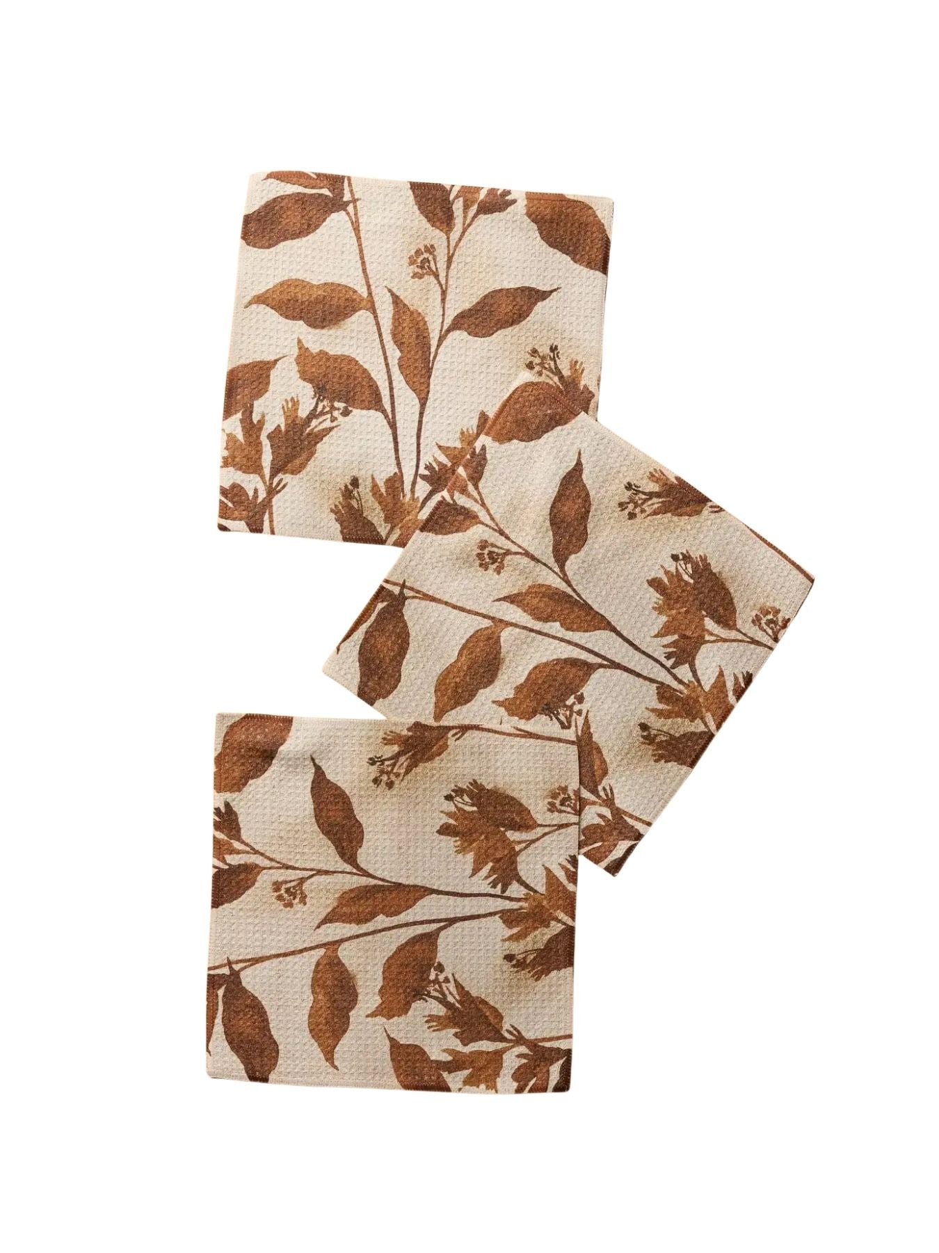 Set of three dish cloth set with brown leaf detail on white background