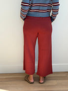 Model is wearing the butter soft drawstring waist cropped pants in merlot. 