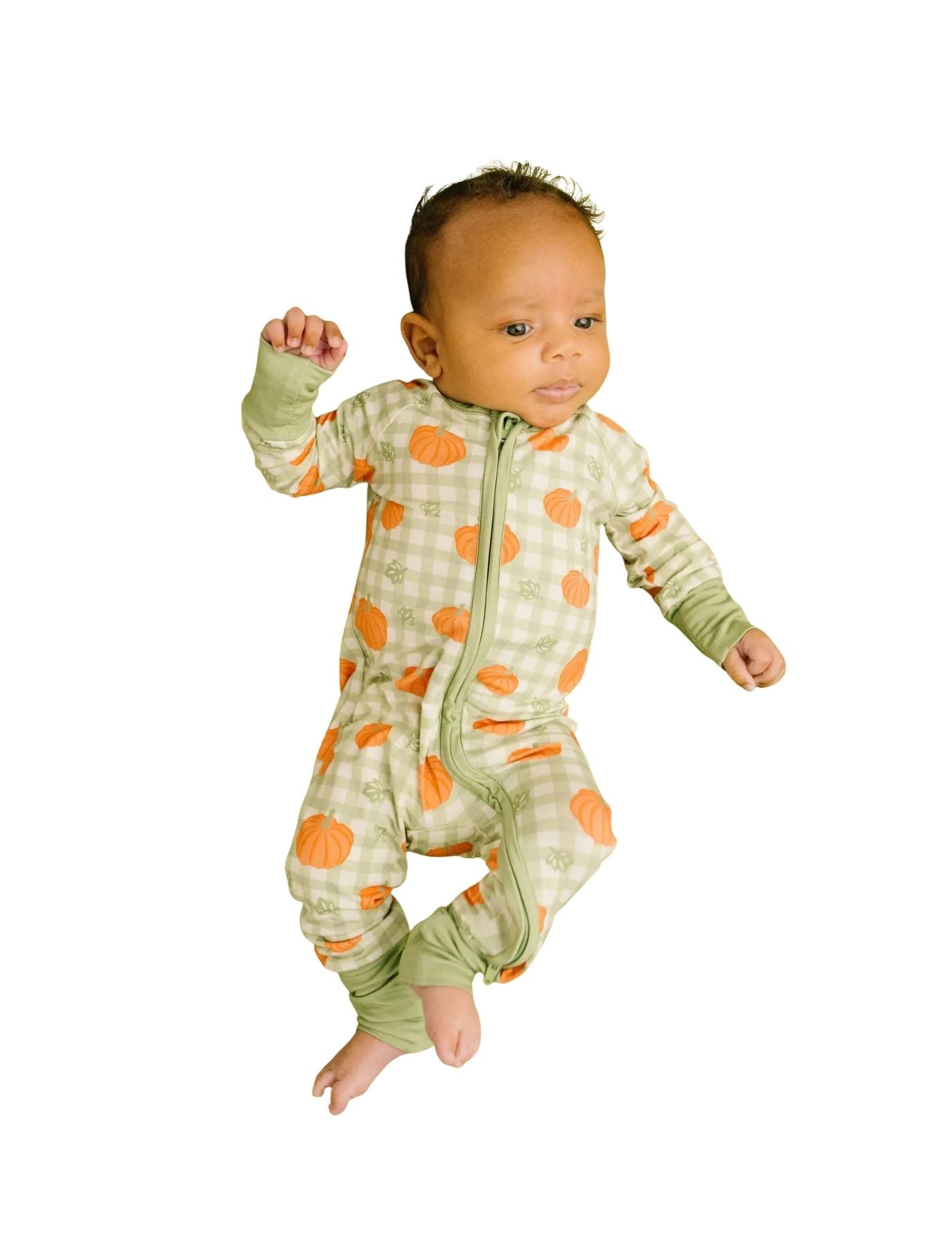 Baby wearing a soft sage gingham bamboo footie with an allover pumpkin print on a white background