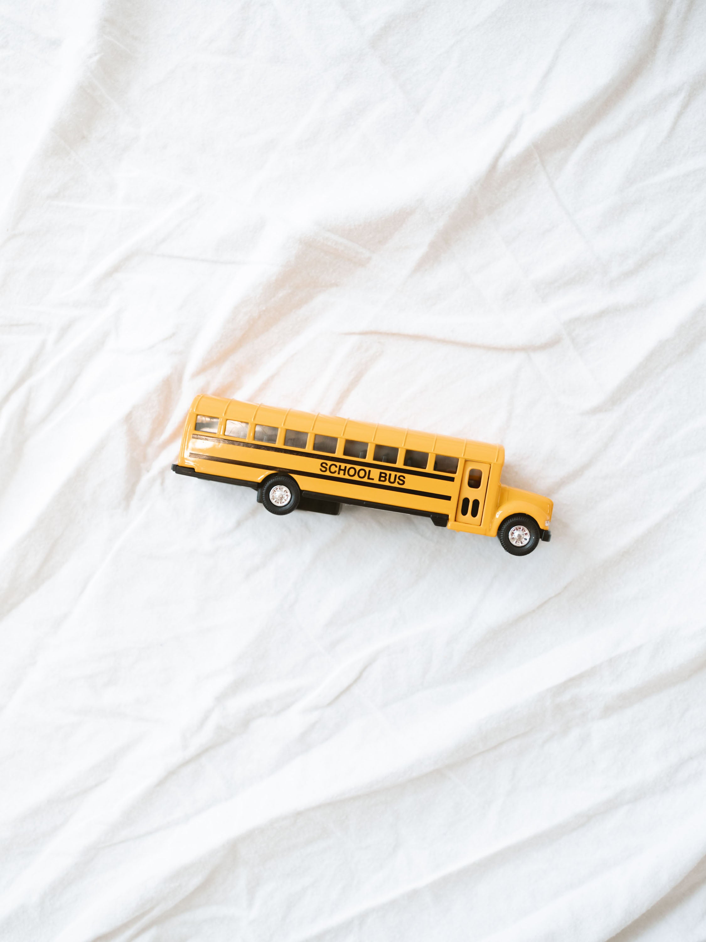 7” toy school bus with wheels that roll and perfect for back to school celebrations or littles that like playing with cars 
