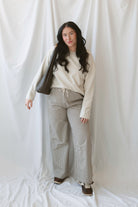 Avery brown and off-white checkered loose fit pants with an adjustable tie-front waist.