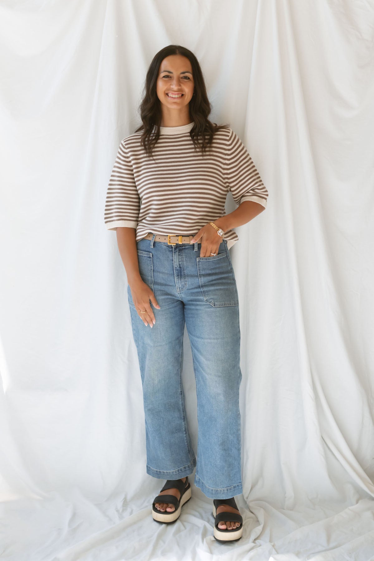 Model wearing the textured stripe crew neck half sleeve top.