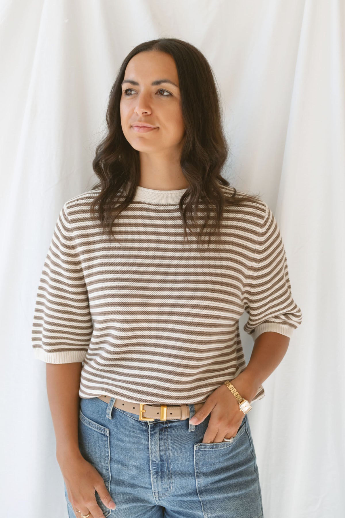 Model wearing the textured stripe crew neck half sleeve top.