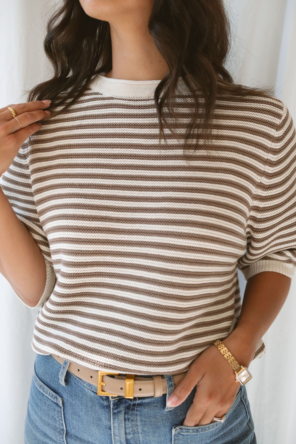 Model wearing the textured stripe crew neck half sleeve top.