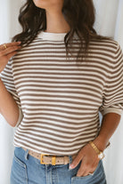 Model wearing the textured stripe crew neck half sleeve top.