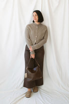 Donna women's Taupe sweater cardigan featuring a classic round neckline, long sleeves, and neutral knit texture for casual everyday layering.