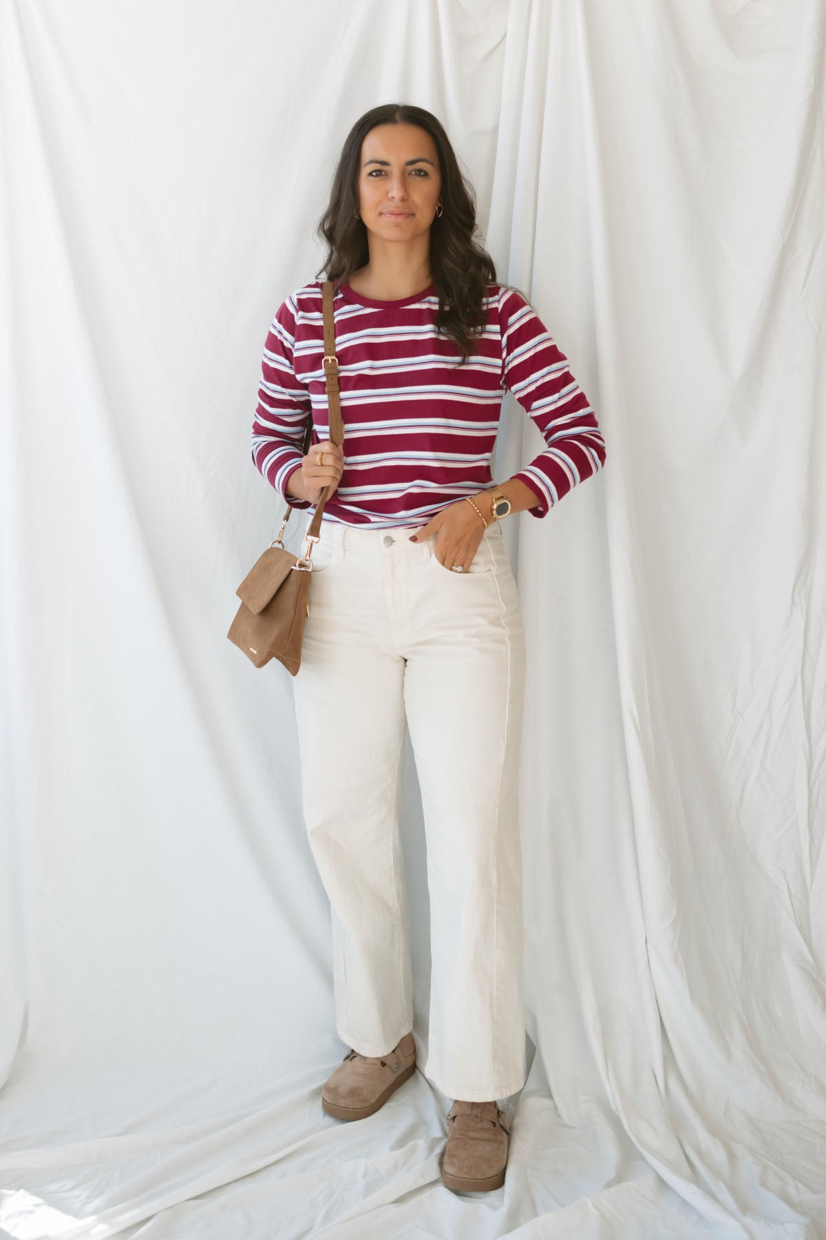 Model is wearing striped long sleeve round neck t-shirt 