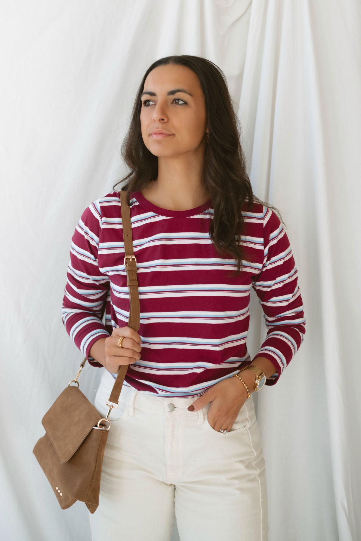 Model is wearing striped long sleeve round neck t-shirt 
