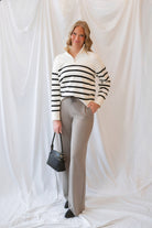 Maggie Striped Half Zip Mock Neck Knit Sweater Top in Cream and Black featuring a striped pattern and half-zip neckline.