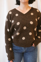Chocolate brown long-sleeve V-neck knit sweater for women featuring contrasting polka dot detailing and a classic feminine silhouette for fall and winter styling.
