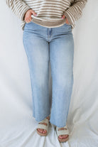 Close up of model wearing the Piper medium wash denim. 